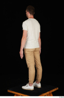  Trent brown trousers casual dressed standing white sneakers white t shirt whole body 0012.jpg